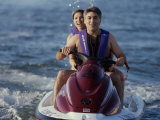 A Couple Riding a Jet Ski in the Sea