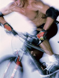 Close-up of a Young Man Riding a Bicycle