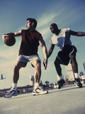 Two Young Men Playing Basketball
