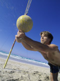 Man Diving for Volleyball on Beach