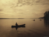 Silhouette of a Canoe in the Water