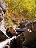 High Angle View of Young Woman Rock Climbing