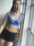 Woman with Weights Looking Out Window