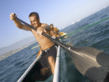 Men Paddling a Canoe