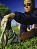 Woman Stretching on a Lawn