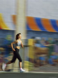 Woman Running on the Sidewalk