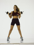 Young Woman Exercising with Dumbbells