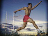 Male Jogger Leaping in a Field