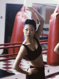 Side Profile of a Young Woman Exercising in a Health Club