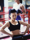 Young Woman Exercising in a Health Club