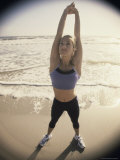 High Angle View of a Young Woman Exercising on the Beach