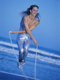 Young Woman Exercising with a Jump Rope