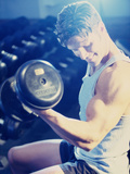 Young Man Exercising with Dumbbells