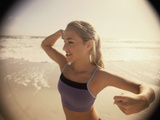 Young Woman Exercising on the Beach