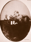 Thomas A Edison Sitting by His Improved Machine  1889