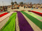 Clothes of Hindu Devotee are Laid out to Dry after Being Drenched During Ritualistic Holy Dips