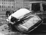 Automobile Destroyed and Flung up Against a Monument During the Flood in Florence