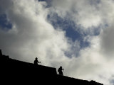Two Tourists Walk in the Ruins of Machu Pichu  Peru