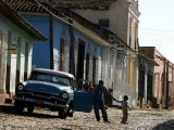 A Cuban Man Gets out of His Car with His Child