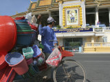 A Cambodian Man Pushes His Bicycle