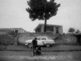 An Afghan Man and a Woman Beg for Money Along the Roadside