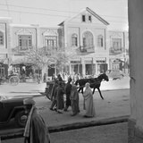 Men and Women  Wearing the Traditional Burqa  Walk Along a Street in Kabul