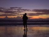 A Father and Son Enjoy Sunset by a Beach