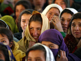 Afghan Children Watch a Performance by Their Fellows During a World Children's Day Get-Together