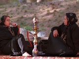 Two Unidentified Iranian Women Smoke a Water Pipe