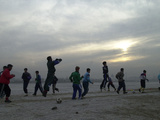 Afghan Youths Warm up Themselves Before a Soccer Match