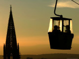 A Couple Sit in a Cable Car Gondola