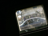 Seen Through the Bulletproof Window of a US Humvee  Iraqis Smile from Their Car