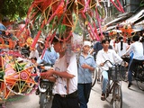 Vietnamese Vendors Crowd a Street Selling Colored Lanterns on a Street in Downtown Hanoi