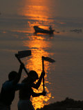 Indian Laborers Work on the Banks of the River Ganges at Sunset