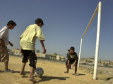 Iraqi Boys Play Soccer in a Baghdad Neighborhood