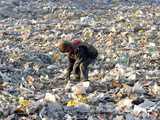 An Impoverished Mongolian Man Sorts Through Garbage at an Ulan Bator Dump