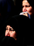 Relatives Grieve at the Funeral