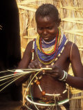 Turkana Woman Weaving near Straw Hut  Lake Turkanam  Kenya