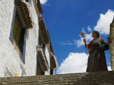 Tibetan Pilgrim with Praying Wheel at Sera Temple  Lhasa  Tibet  China