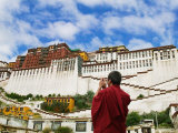 Tibetan Monk with Potala Palace  Lhasa  Tibet  China