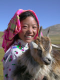 Tibetan Girl Holding Sheep in the Meadow  East Himalayas  Tibet  China