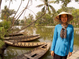 Woman Near Old Boats  Mekong Delta  Vietnam