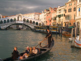 Gondola with Tourists in the Grand Canal  Venice  Italy