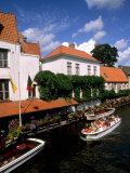 Houses and Boats with Tourists  Canals of Bruges  Belgium