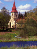 Church Nestled in Rural Landscape with Boat and Pond  Latvia