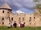 Girls in Traditional Dress Singing and Dancing in Spring-time Dandelion Fields  Latvia
