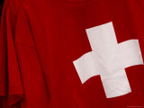 Close-up of the Swiss Flag with a Whtie Cross on Red Fabric