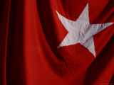 Close-up of the Flag of Turkey with a White Star on Red Fabric