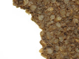 Close-up of a Rough Eaten Granola Bar with Chunks of Grains