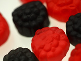 Close-up of Red and Black Chewy Candy Pieces